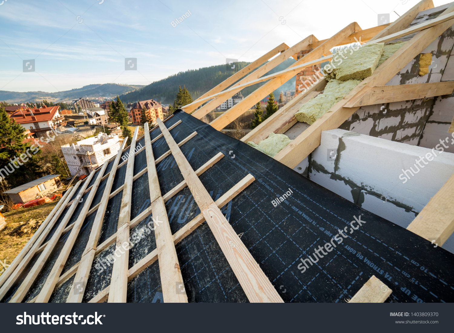 stock-photo-kyiv-ukraine-august-roof-frame-of-wooden-beams-on-walls-of-hollow-foam-insulation-1403809370