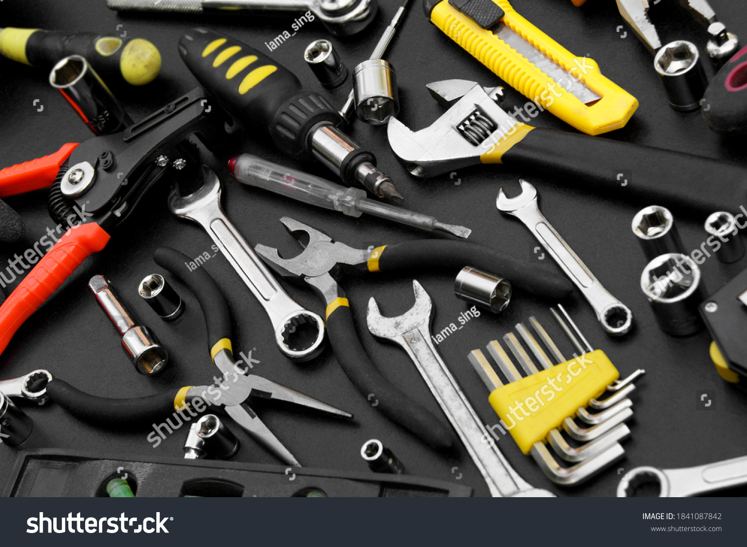 stock-photo-many-different-tools-for-repair-work-on-a-black-background-repair-and-construction-concept-1841087842