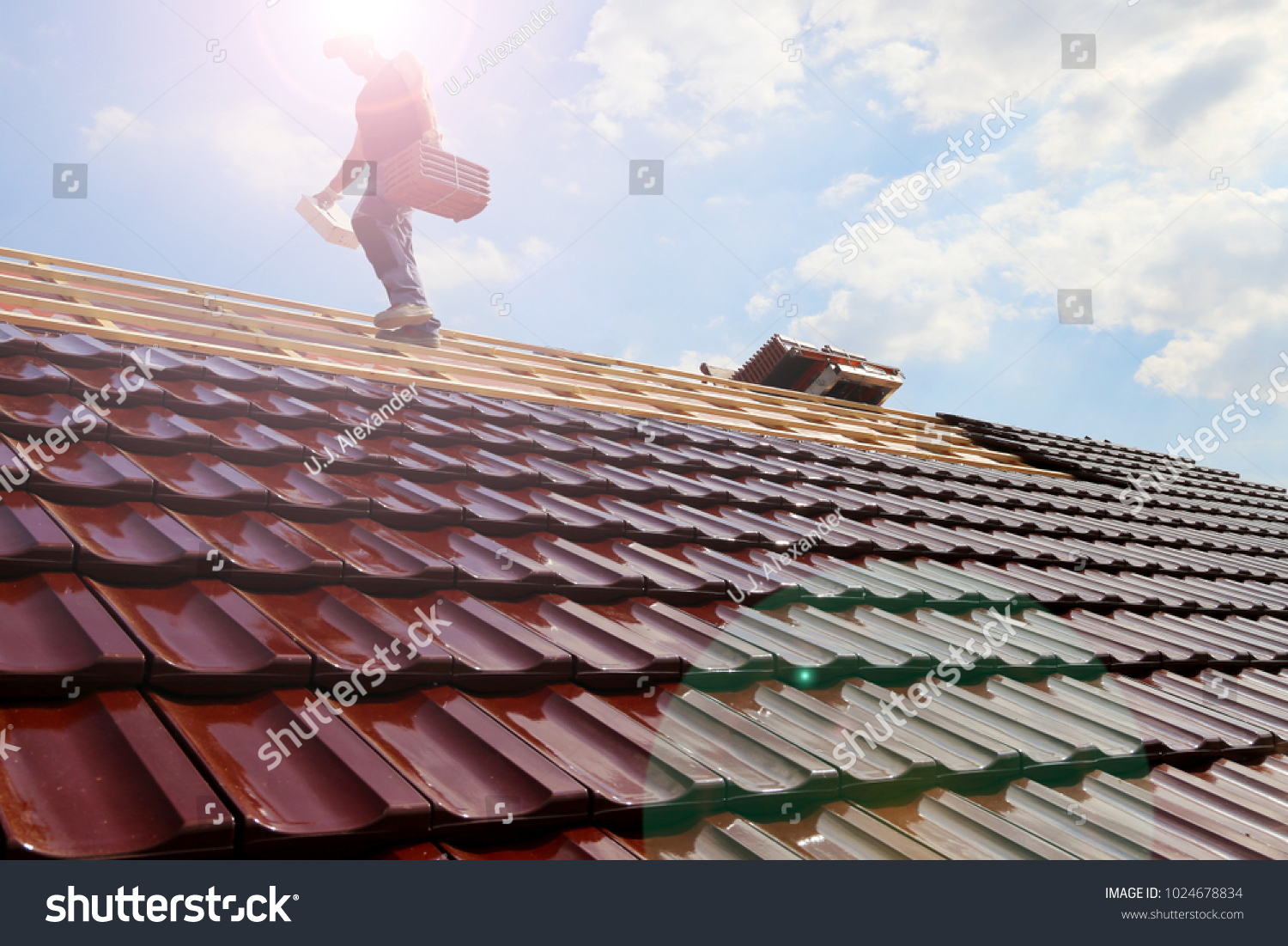 stock-photo-tiling-a-roof-1024678834